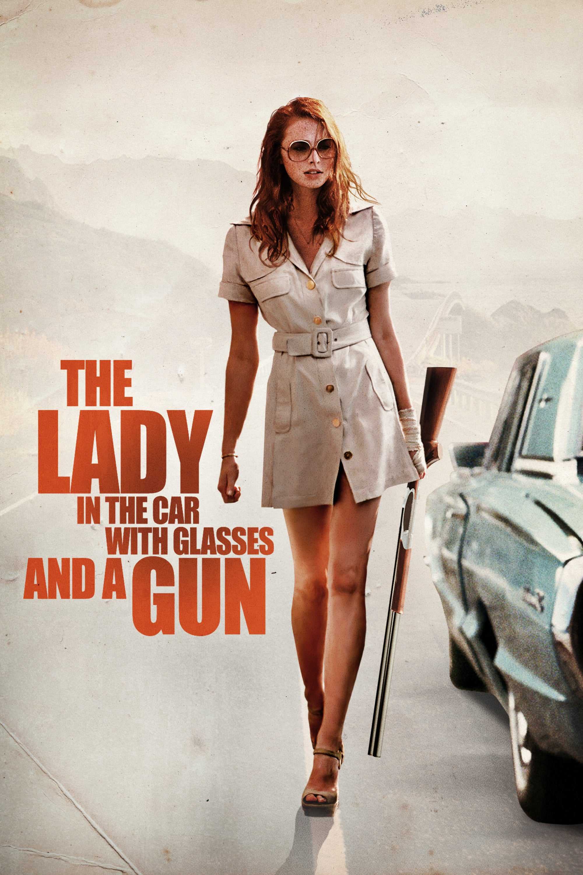 Cô gái trong xe đeo kính với khẩu súng - The lady in the car with glasses and a gun